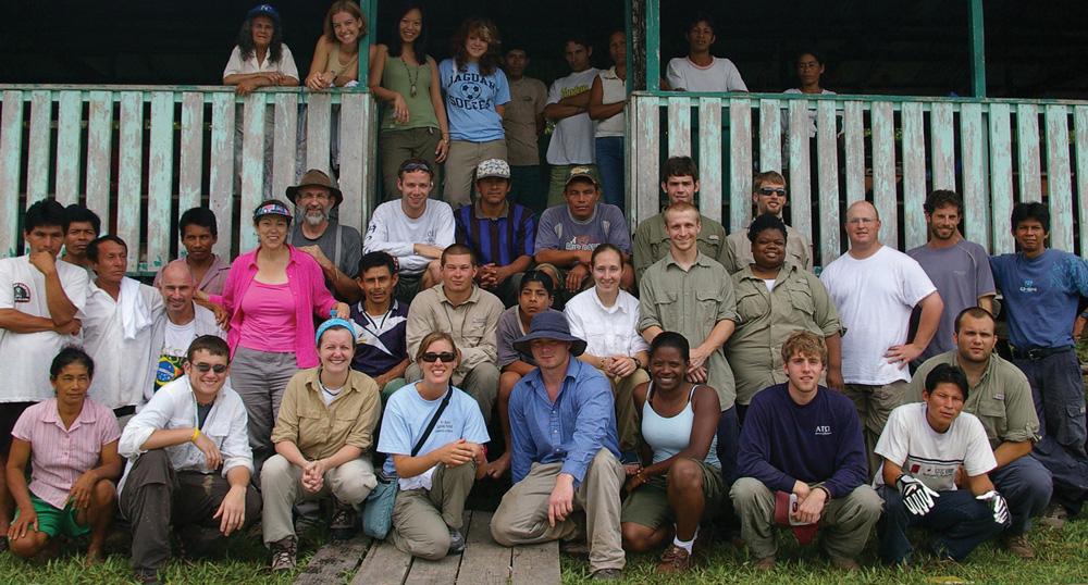 Engineering professors Dr. Pauline Johnson (pink shirt) and Dr. Philip Johnson (next to her, in Indiana Jones hat), shown here with their students in Peru, have blended service-learning and engaged scholarship that has gained international attention through the Engineers Without Borders organization and their own published research.