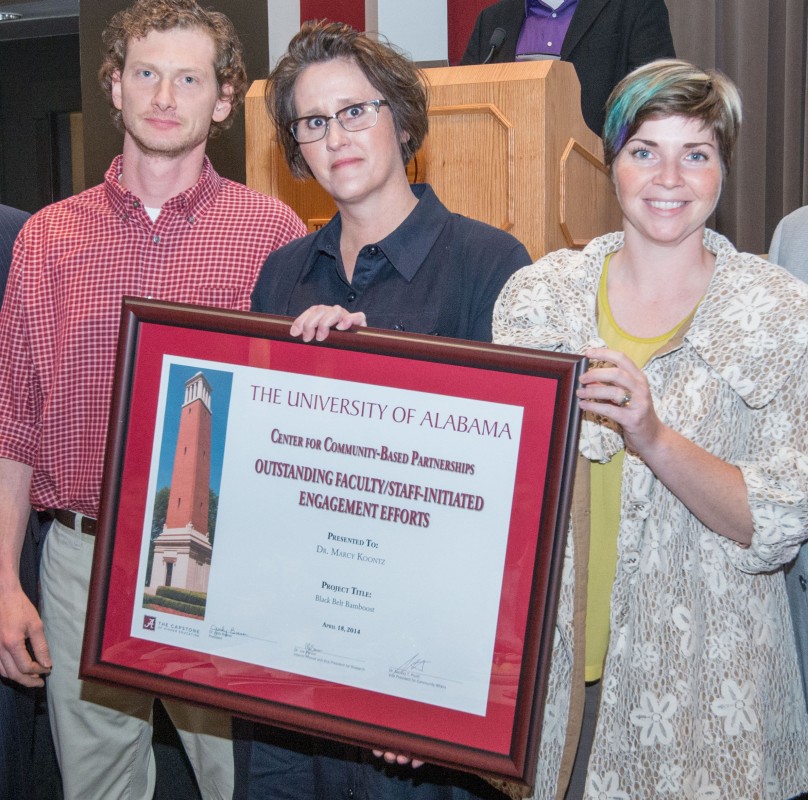 Dr. Marcy Koontz, center, College of Human Environmental Sciences, stands with two of her student assistants in the award-winning Black Belt Bamboost project.