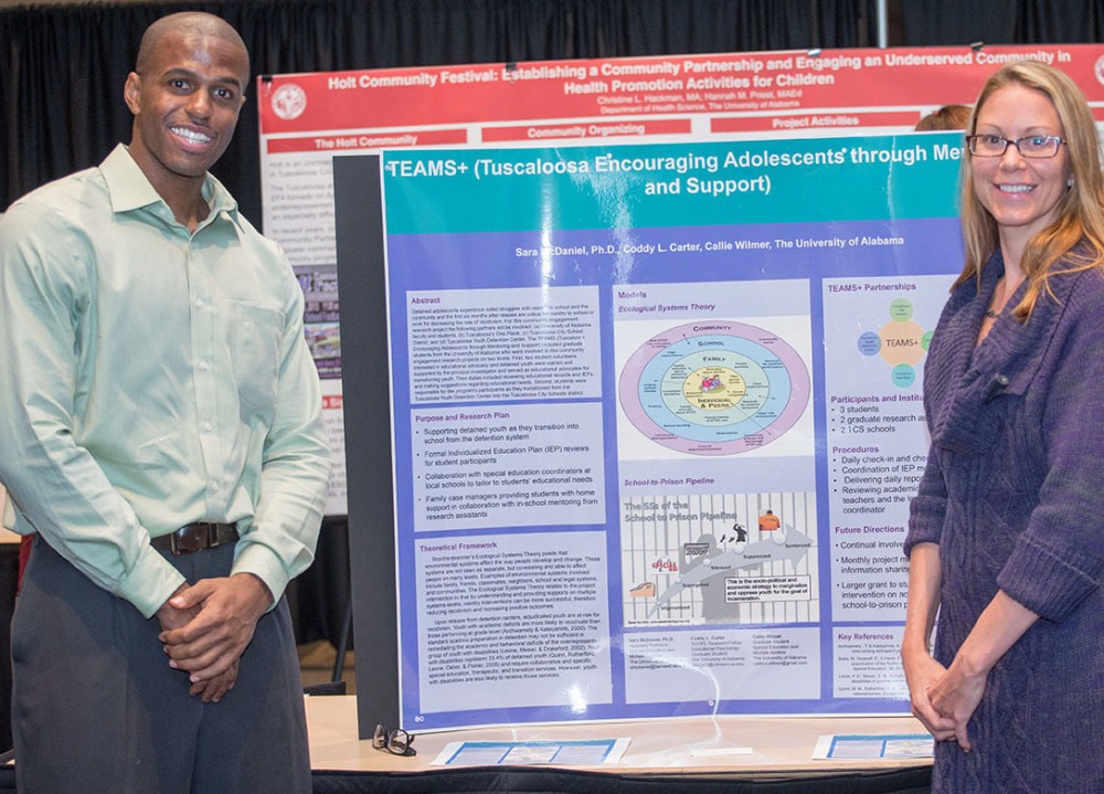 Dr. Sara McDaniel is shown here with graduate student Coddy Carter with their research poster TEAMS+ (Tuscaloosa Encouraging Adolescents Through Mentoring and Support).