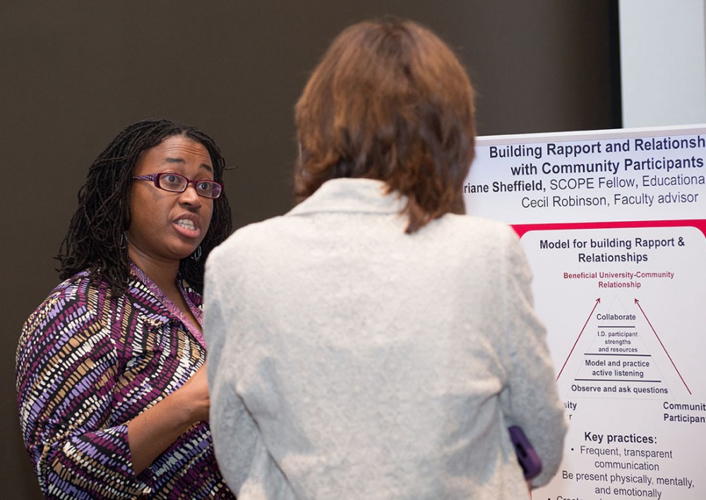 SCOPE fellow Adriane Sheffield, a graduate student in Educational Psychology, describes her research at the 2014 CCBP research poster display. Sheffield also was recognized as a Seed Funds recipient to conduct further research.