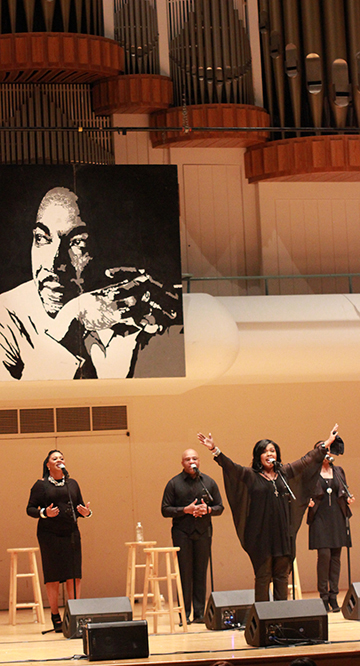 Gospel singer CeCe Winans told the audience that appearing on stage with Dr. Martin Luther King looming in the background made her realize "I am famous!"