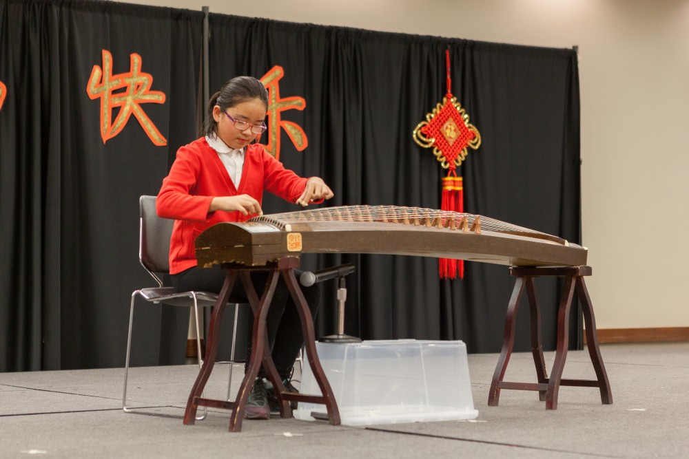 Lidan Zhang’s playing of the Chinese guzheng, a traditional stringed instrument, drew enthusiastic applause.