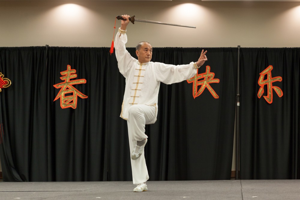 Wenting Liang performs Tai Chi with traditional sword.