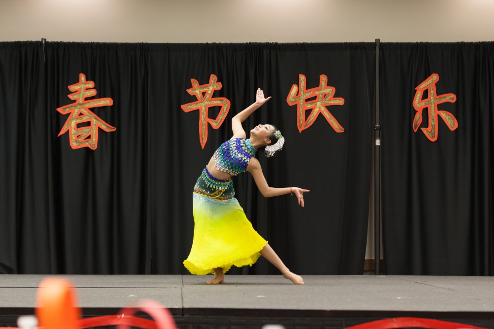 Junqi Sun gives a solo performance of the Chinese Dai dance.