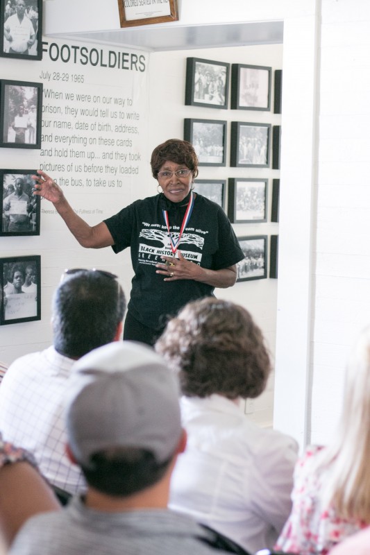 The University of Alabama’s inaugural Community Engagement tour for new faculty, staff, students and community members and partners is taking place May 10–12 across nine Alabama counties. Here, on day one, legendary Civil Rights activist Theresa Burroughs speaks to tour participants at The Safe House Black History Museum in Greensboro. Designed to serve as a source of inspiration for individuals to connect research passions to addressing community needs through new partnerships, the tour is hosted by the UA Division of Community Affairs, in partnership with the Office of Academic Affairs, the Graduate School, the Center for Community-Based Partnerships and the Council on Community-Based Partnerships.