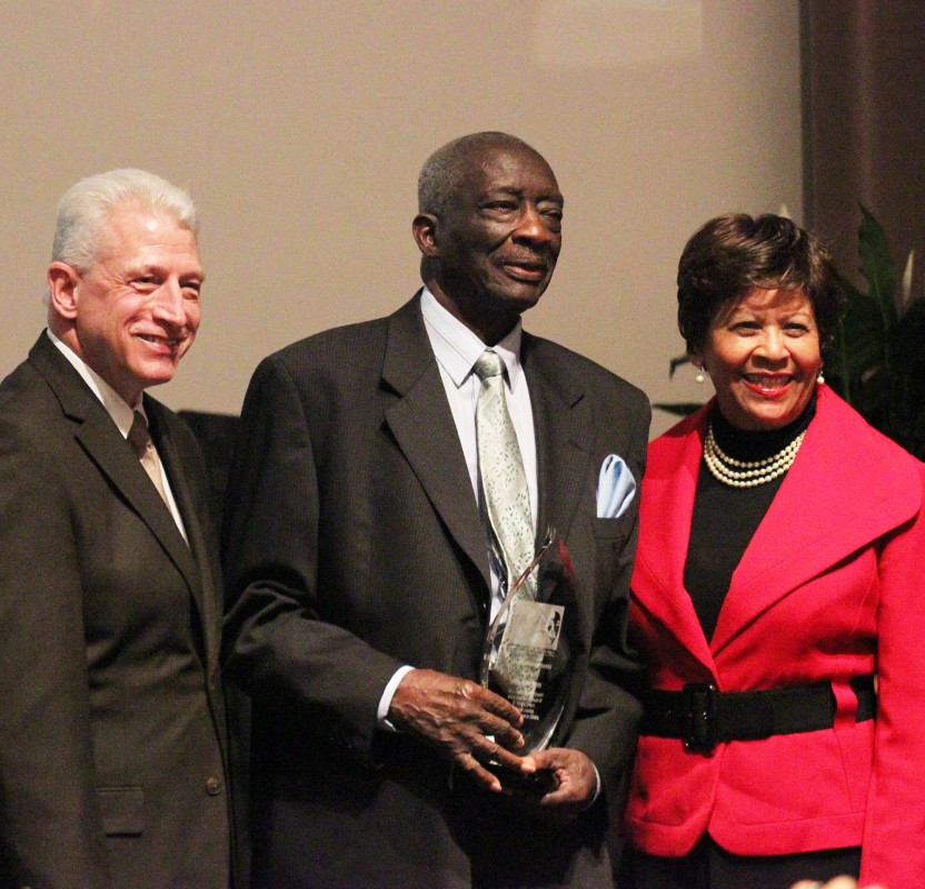 Rev. Frank Dukes, receiving Mountaintop Award, attended by Dr. Kevin Whitaker, UA provost and academic vice president, and Dr. Cynthia Warrick, Stillman College president.