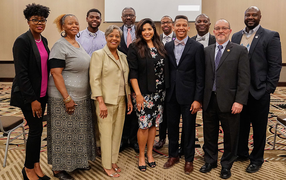 Distinguished Lecturer Julissa Arce poses for photo with representatives from the sponsoring organizations, UA, Stillman College, Shelton State and the SCLC.