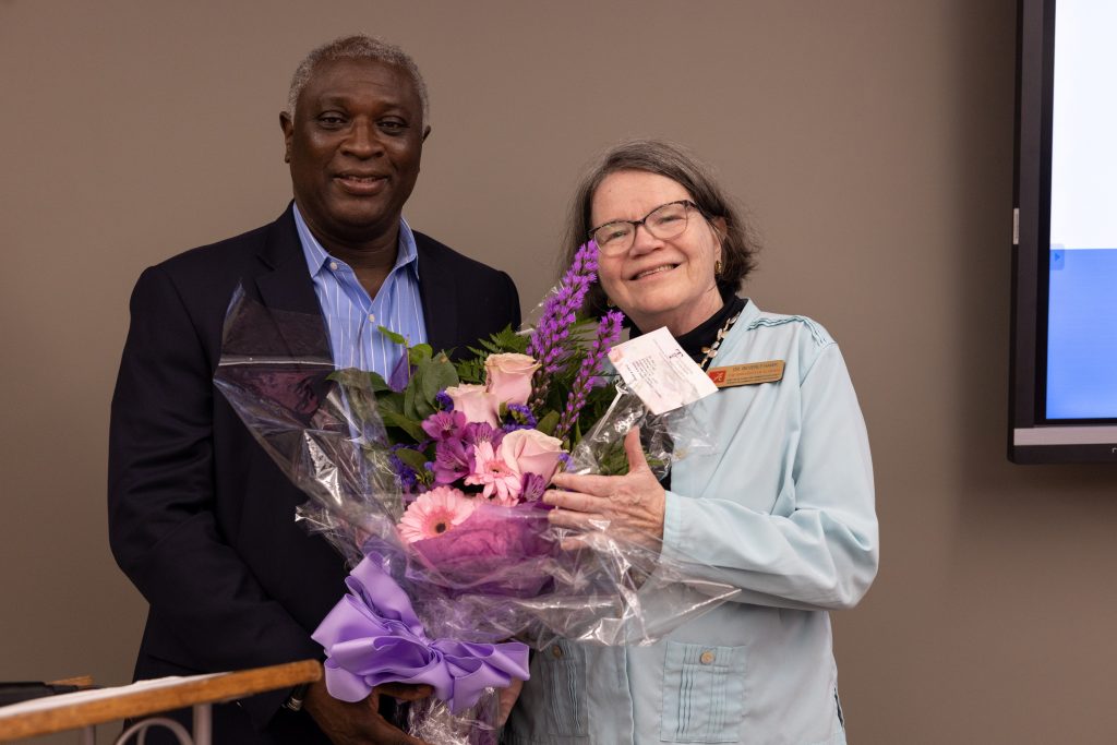 Vice President for Community Affairs, Dr. Samory Pruitt (left) congratulates Dr. Beverly Hawk (right) on her retirement, thanking her for her commitment to Fulbright opportunities and global community engagement at UA.