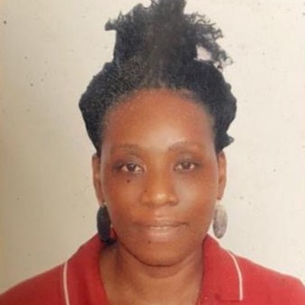 Headshot of Ihuoma Ezebuihe wearing a red collared shirt