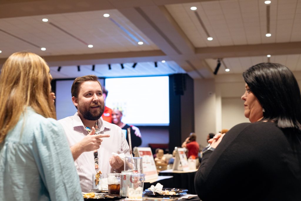 Participants talking over hors d'oeuvres