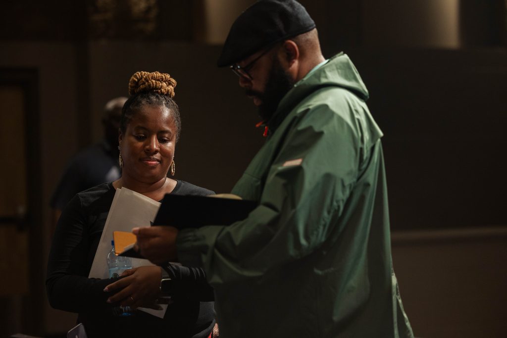 Two adults looking at pamphlet together