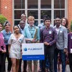 Group of people posing with FulBright Logo