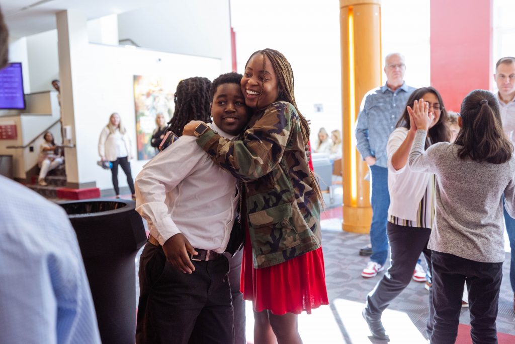 Young girl and boy hugging