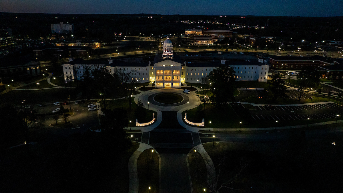 Aerial photo of a campus building at night