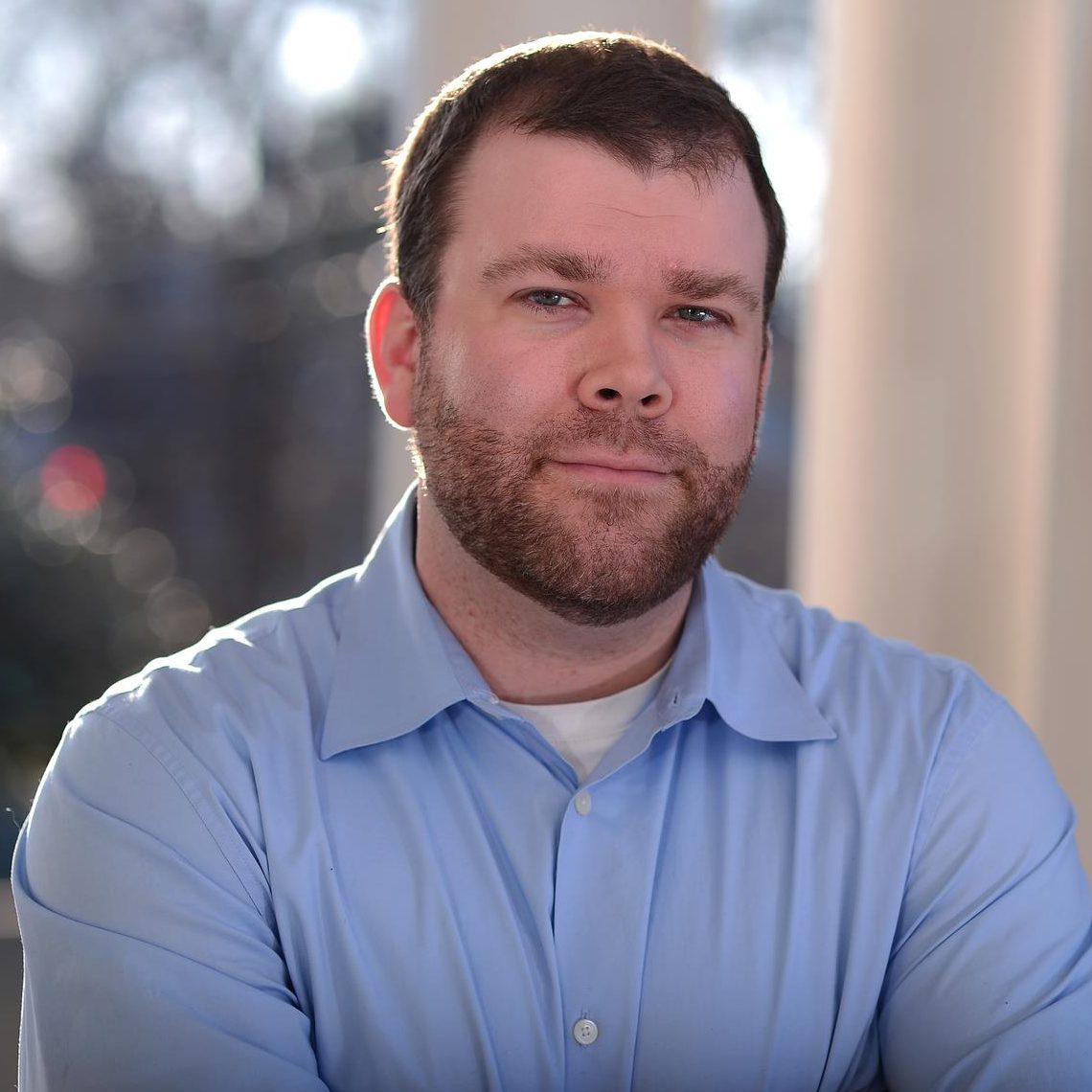 Headshot of Luke Connell wearing blue shirt