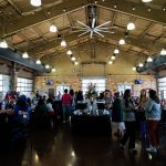 People gathered in a building with food and drinks