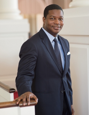 Jonathan Walton dressed in a blue suit